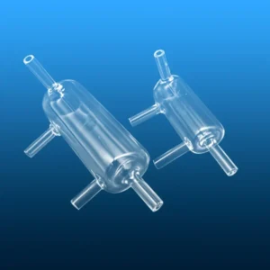 A collection of three quartz overflow bottles of varying sizes, showcasing their multi-port design and clear fused silica construction for analytical use.