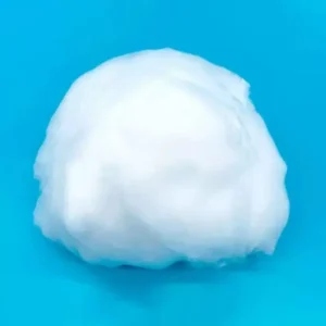 A fluffy, white pile of high-purity quartz wool or fused silica wool, displayed centrally on a vibrant blue background.