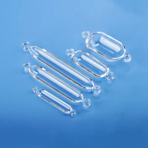 A collection of clear double-ear quartz boats in various sizes, arranged on a blue background.