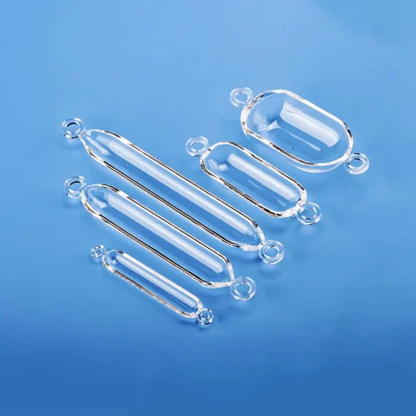 A collection of clear double-ear quartz boats in various sizes, arranged on a blue background.