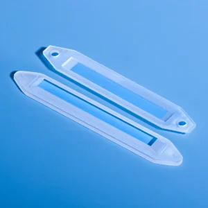 Two high-purity custom fused quartz sample boats designed for sulfur analyzers, showcasing their precise construction.