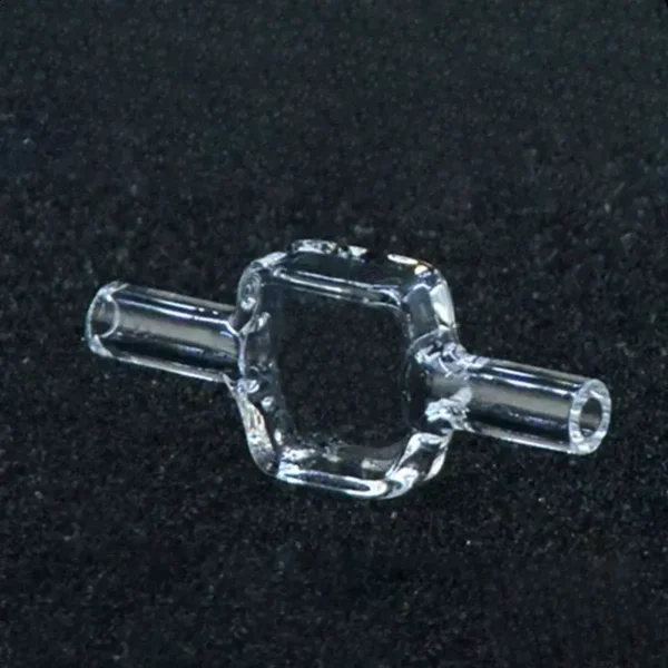 10mm Pathlength Quartz Fluorescence Flow Cell | Fused Silica Analytical Cuvette 10 A single transparent 10mm pathlength quartz fluorescence flow cell with connecting tubes, shown against a dark, textured background, highlighting its intricate glasswork.