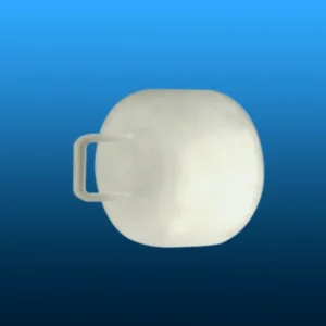 A light-colored, oval quartz thermal block with a handle, viewed from the side, against a blue background, emphasizing its solid construction.