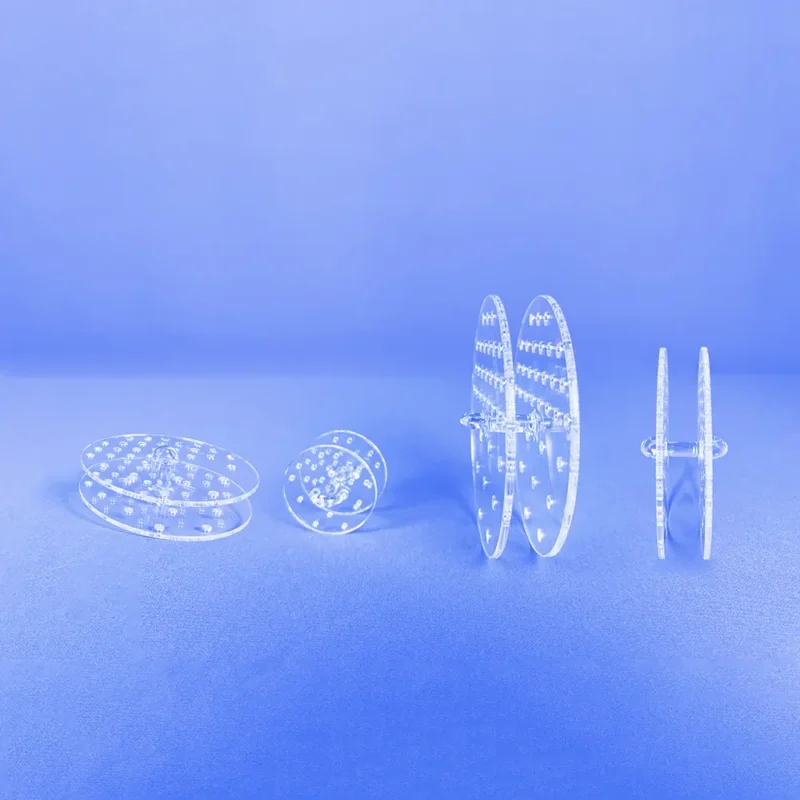 Quartz Gas Diffuser | Fused Silica Furnace Tube Gas Distributor 8 Several clear quartz perforated plates arranged to illustrate different configurations of gas diffuser inserts.