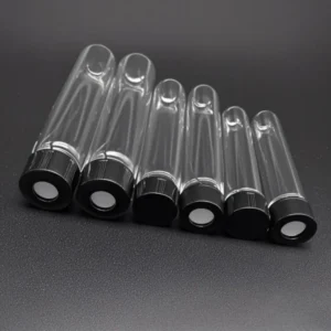 Quartz Round Bottom Threaded Vials | Fused Silica Screw Cap Tubes 8 A row of clear quartz round bottom threaded vials, all fitted with black screw caps, varying in size, presented on a dark surface.
