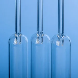 Three upright high-purity quartz combustion tubes with inner tubes, showcasing their full length and transparent quality.