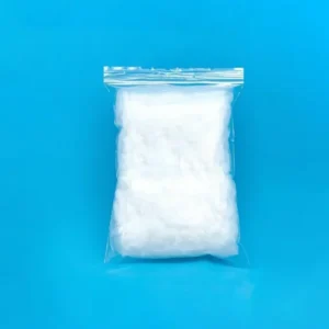 A sealed clear plastic bag filled with high-purity quartz wool, indicating a typical packaging format for the product, set against a blue backdrop.