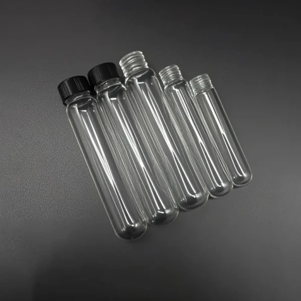 Quartz Round Bottom Threaded Vials | Fused Silica Screw Cap Tubes 5 A mixed arrangement of clear quartz round bottom threaded vials, some with black screw caps and others with exposed threads, showcasing their uniform design.