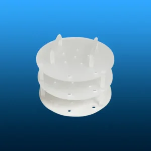 A multi-tiered, light-colored quartz thermal block or sample support with perforated layers and vertical posts, for specialized furnace applications.