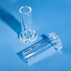 Two single end quartz tubes with flanges, one standing upright and one lying down, on a blue background, illustrating their design from different angles.