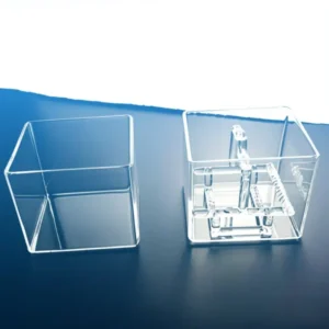 Two clear, empty square quartz tanks (one smaller, one larger) without internal racks, showcasing their transparent, clean design.